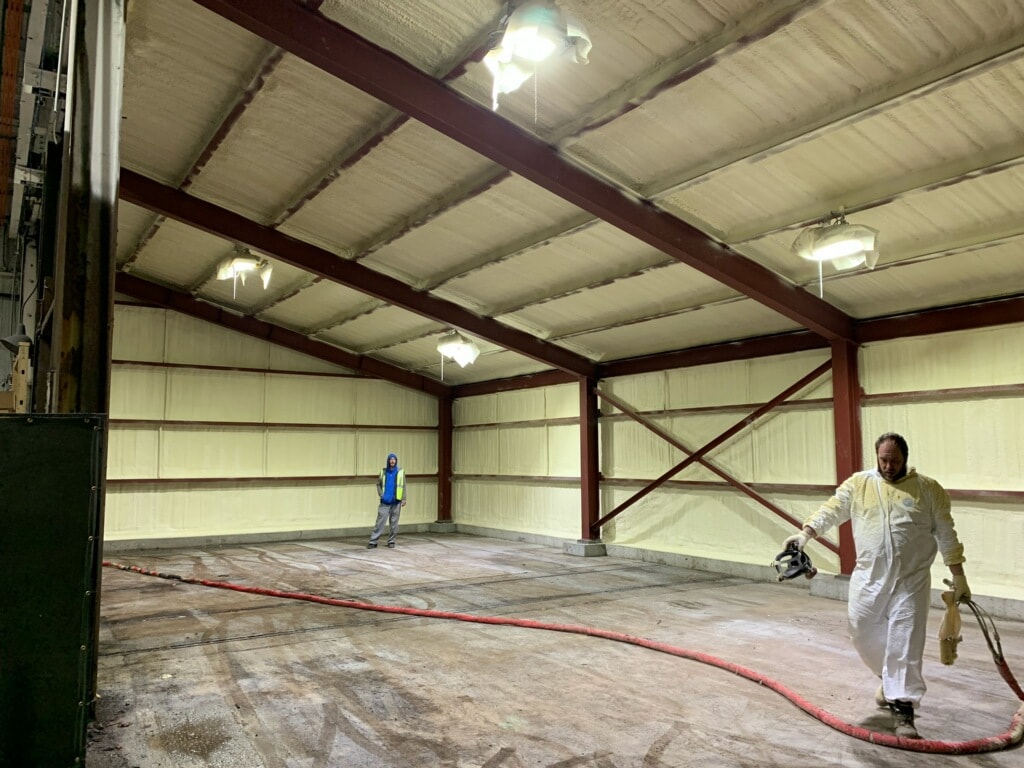 SprayTight Inc crew finishing a spray foam insulated metal building in Michigan