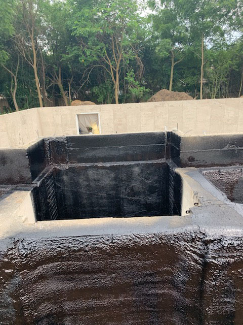 Foundation waterproofing spray application in Michigan