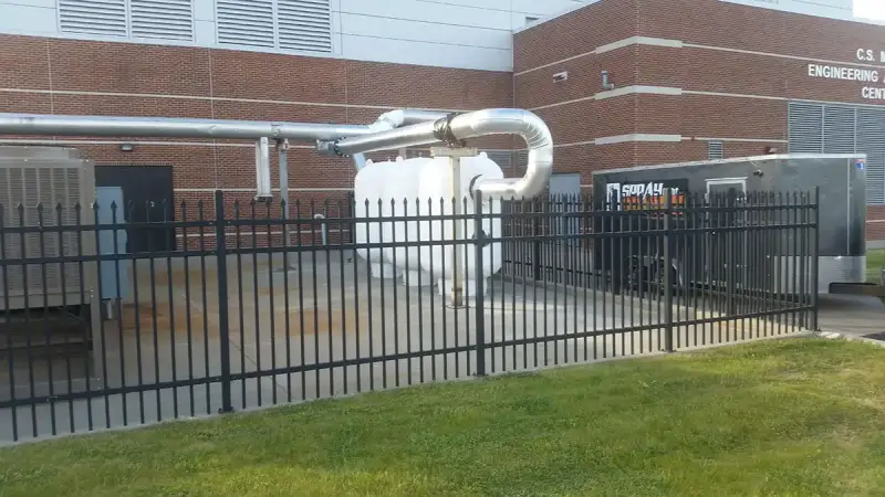 Foam-coated industrial gas tanks and insulated piping at a Michigan facility