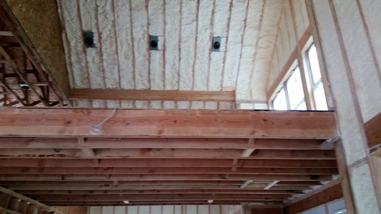 Spray foam being applied to an attic roof deck in Oakland County Michigan